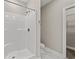 A bright bathroom featuring a shower, toilet, and entry to the walk-in closet at 344 Kiskadee Loop # E, Conway, SC 29526
