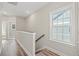 Bright hallway leading to stairs and other rooms at 344 Kiskadee Loop # E, Conway, SC 29526