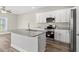 Kitchen with large island, stainless appliances, granite countertop, and hardwood style flooring at 344 Kiskadee Loop # F, Conway, SC 29526