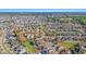 An aerial view showcasing the homes of a neighborhood, lakes, and the horizon in the distance at 3516 Queens Harbour Blvd., Myrtle Beach, SC 29588