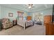 Bedroom with carpeting, ceiling fan, natural light, a queen-sized bed, and an exercise bike at 3516 Queens Harbour Blvd., Myrtle Beach, SC 29588