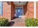 Inviting entryway with a decorative blue front door and charming decor at 3516 Queens Harbour Blvd., Myrtle Beach, SC 29588