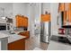 The kitchen includes stainless steel appliances, plenty of cabinets, and an open view into the living room at 3516 Queens Harbour Blvd., Myrtle Beach, SC 29588