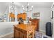 Eat-in kitchen boasts stainless appliances, neutral walls, and a large kitchen island with bar stool seating at 3516 Queens Harbour Blvd., Myrtle Beach, SC 29588