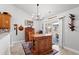 An eat-in kitchen featuring a large kitchen island, a sliding door to the outdoor patio, and a wine rack at 3516 Queens Harbour Blvd., Myrtle Beach, SC 29588