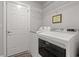 Bright laundry room includes a newer washer and dryer and storage at 3516 Queens Harbour Blvd., Myrtle Beach, SC 29588