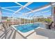 Sparkling in-ground pool with a screened enclosure and ample seating for relaxation at 3516 Queens Harbour Blvd., Myrtle Beach, SC 29588