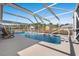 Beautiful in-ground pool enclosed with white beams and screening, with outside furniture and easy access points at 3516 Queens Harbour Blvd., Myrtle Beach, SC 29588