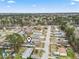 Aerial view shows home nestled in quiet neighborhood, surrounded by lush greenery and well-maintained streets at 3530 Reavis Ln., Myrtle Beach, SC 29579