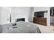 Bedroom featuring light grey shiplap walls, hardwood dresser, and a queen sized bed at 3530 Reavis Ln., Myrtle Beach, SC 29579