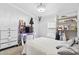 Bedroom with neutral decor featuring a workstation, shelving, and closet space at 3530 Reavis Ln., Myrtle Beach, SC 29579