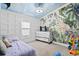bedroom featuring safari themed wallpaper, light colored walls, and a fun ceiling at 3530 Reavis Ln., Myrtle Beach, SC 29579
