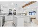 Bright kitchen featuring an island, marble counters, modern lighting and stainless steel appliances at 3530 Reavis Ln., Myrtle Beach, SC 29579