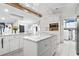 Kitchen island with marble countertops and bright white cabinets with stainless appliances at 3530 Reavis Ln., Myrtle Beach, SC 29579