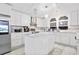 Bright white kitchen with marble countertops, stainless steel appliances, and ample storage at 3530 Reavis Ln., Myrtle Beach, SC 29579