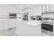 Kitchen island with marble countertops and bright white cabinets with stainless appliances at 3530 Reavis Ln., Myrtle Beach, SC 29579