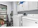 Well-equipped laundry room with appliances, storage cabinets, and shelving at 3530 Reavis Ln., Myrtle Beach, SC 29579