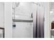 Modern shower with marble tile and a rainfall showerhead, providing a spa-like experience at 3530 Reavis Ln., Myrtle Beach, SC 29579