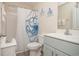 Clean bathroom with shower featuring an octopus-themed curtain at 3952 Murrells Inlet Rd., Murrells Inlet, SC 29576