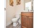 Cozy half bathroom featuring a toilet, vanity, modern fixtures, and neutral decor at 3952 Murrells Inlet Rd., Murrells Inlet, SC 29576