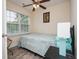 Bright bedroom featuring a window, ceiling fan, neutral walls, and comfortable furnishings at 3952 Murrells Inlet Rd., Murrells Inlet, SC 29576