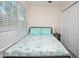 Bright bedroom with window and queen-size bed featuring aqua bedding at 3952 Murrells Inlet Rd., Murrells Inlet, SC 29576