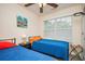 A bedroom with a ceiling fan, two twin beds, and neutral walls at 3952 Murrells Inlet Rd., Murrells Inlet, SC 29576