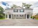 Charming two-story duplex with gray siding, black shutters, and well-maintained landscaping at 3952 Murrells Inlet Rd., Murrells Inlet, SC 29576