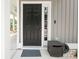 Inviting front door with a modern black finish, and an adjacent outdoor storage unit at 3952 Murrells Inlet Rd., Murrells Inlet, SC 29576