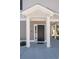 A charming front entryway with black door, white pillars, and manicured landscaping at 3952 Murrells Inlet Rd., Murrells Inlet, SC 29576
