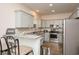An open-concept kitchen boasts granite countertops, stainless steel appliances, and ample cabinet space at 3952 Murrells Inlet Rd., Murrells Inlet, SC 29576