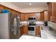 Modern kitchen featuring stainless steel appliances, granite countertops, and ample wood cabinets at 3952 Murrells Inlet Rd., Murrells Inlet, SC 29576