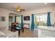 Cozy living room with a ceiling fan, TV, comfortable sofa and a foosball table at 3952 Murrells Inlet Rd., Murrells Inlet, SC 29576