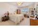 Bright bedroom with a ceiling fan, a desk, and a large window at 3986 Lochview Dr., Myrtle Beach, SC 29588