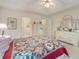 Bright bedroom featuring a large bed and a glimpse into an ensuite bathroom and lots of natural light at 3986 Lochview Dr., Myrtle Beach, SC 29588