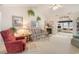 Cozy living room featuring a fireplace, floral sofa, comfortable armchair and vaulted ceiling at 3986 Lochview Dr., Myrtle Beach, SC 29588