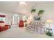 Bright living room showcasing a floral sofa, comfy seating and decor, filled with natural light at 3986 Lochview Dr., Myrtle Beach, SC 29588
