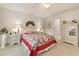 Serene main bedroom with a large bed, dresser and ensuite bathroom entry at 3986 Lochview Dr., Myrtle Beach, SC 29588