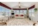 Charming sunroom featuring large windows, a comfortable sofa, and stylish decor, perfect for enjoying the natural light at 3986 Lochview Dr., Myrtle Beach, SC 29588