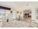 Bright sunroom with a cozy seating area, tile flooring, and garden views, ideal for relaxation and enjoyment at 3986 Lochview Dr., Myrtle Beach, SC 29588
