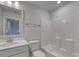 Clean bathroom features a tub and shower combination, a toilet, vanity, and decorative mirror at 4036 Bucolic Loop, Myrtle Beach, SC 29588
