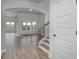 Bright foyer features wood flooring, archways, and leads to the open-concept living area at 4036 Bucolic Loop, Myrtle Beach, SC 29588