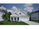 Charming single Gathering home featuring neutral siding, a two-car garage, and manicured lawn at 4036 Bucolic Loop, Myrtle Beach, SC 29588