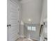 Bright hallway with a staircase leading to the next level and white doors adds architectural interest at 4036 Bucolic Loop, Myrtle Beach, SC 29588