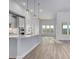 Open-concept kitchen featuring an island with modern pendant lighting and stainless steel appliances at 4036 Bucolic Loop, Myrtle Beach, SC 29588
