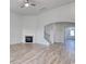 Open-concept living room with fireplace and archway to foyer at 4036 Bucolic Loop, Myrtle Beach, SC 29588