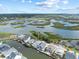 Breathtaking aerial view of waterfront homes and marshlands under a partly cloudy sky at 409 36Th Ave. N, North Myrtle Beach, SC 29582