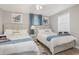 Comfortable bedroom with two beds, decorative pillows, and soothing beach-themed decor at 409 36Th Ave. N, North Myrtle Beach, SC 29582