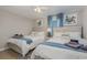 Charming bedroom with two cozy beds, beach-themed decor, and ample natural light at 409 36Th Ave. N, North Myrtle Beach, SC 29582