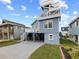 Coastal home featuring multiple decks and a sturdy, elevated foundation, all with a charming blue exterior at 409 36Th Ave. N, North Myrtle Beach, SC 29582